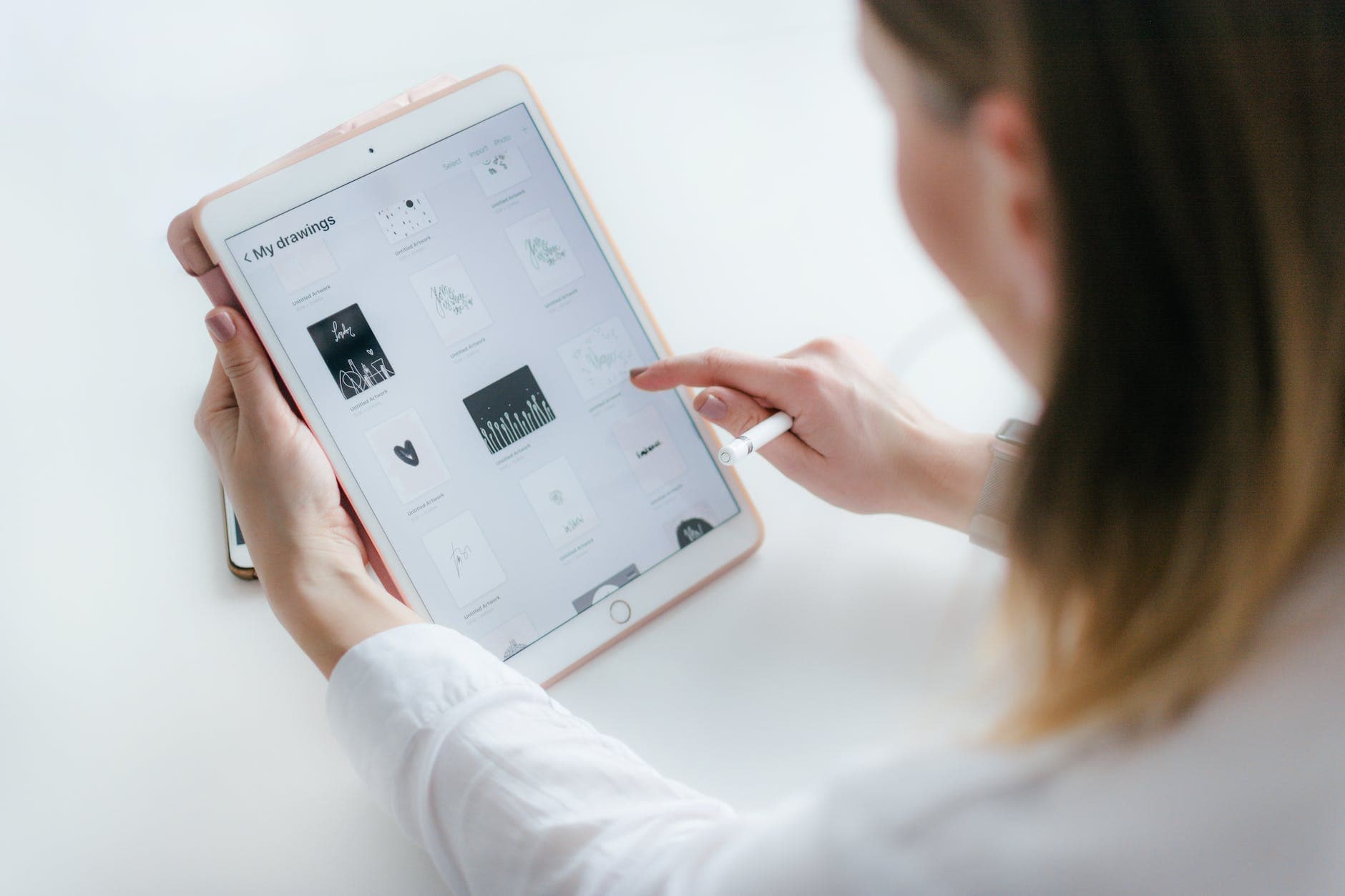 Designer reviewing interface specifications on a drawing tablet